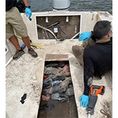 AMO agents discover a hidden compartment in a vessel that is used to smuggle drugs