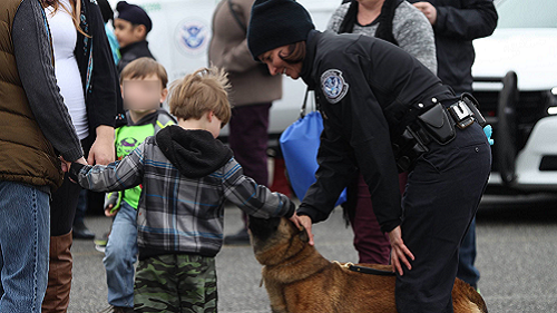 Kids visiting with CBP canine at family outreach event in Blaine Washington