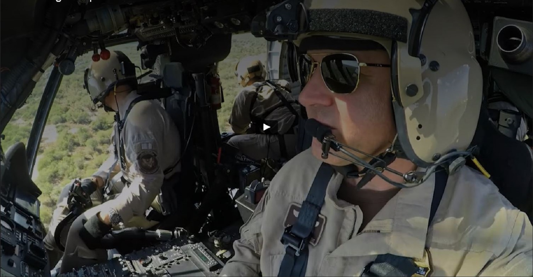 Two Air and Marine Operations pilots conduct patrol operations in a UH-60 Black Hawk helicopter.