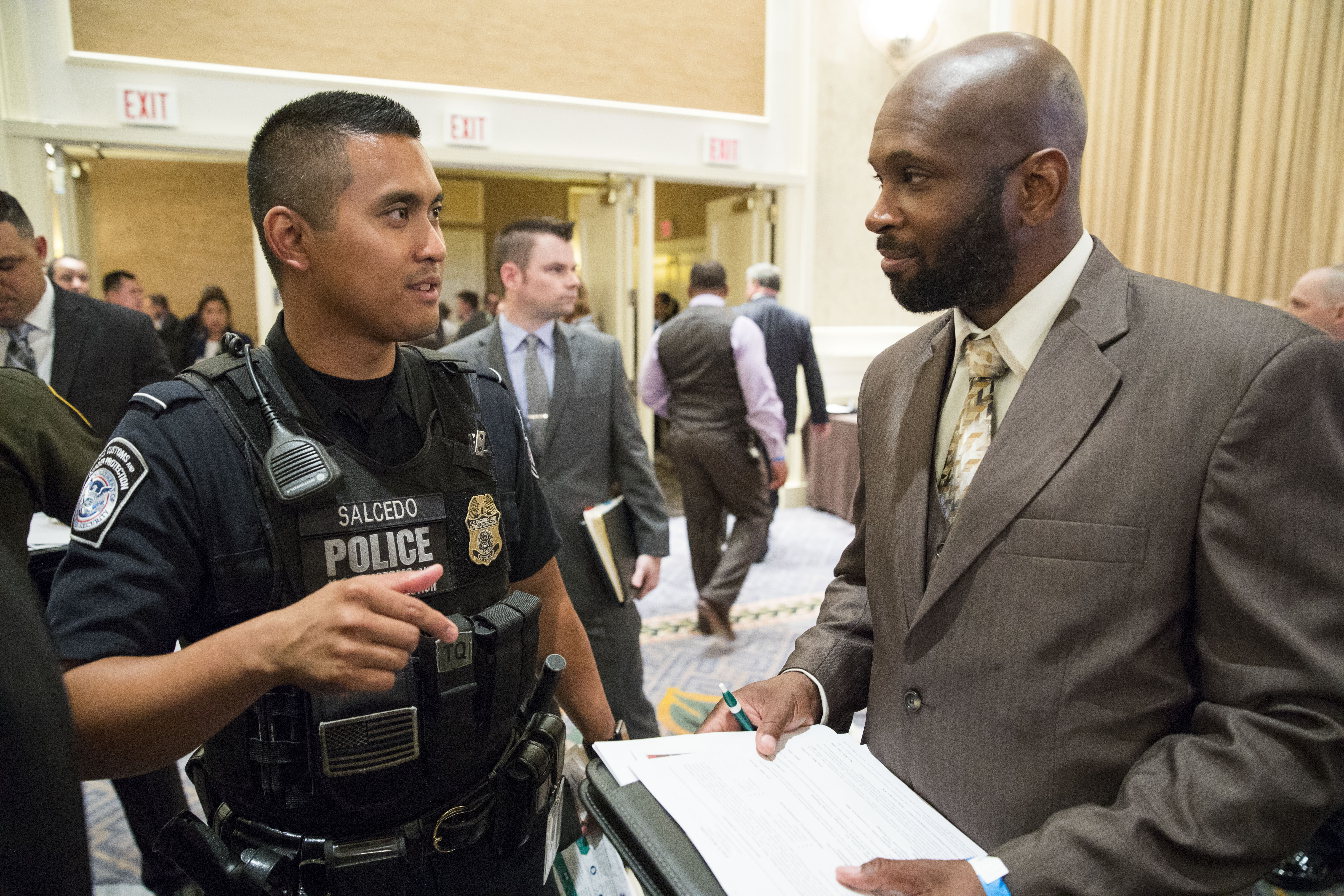 Office of Field Operations recruiter speaking to a recruit.