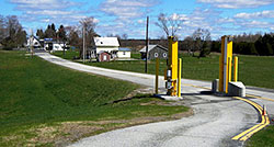 Morses Line today - looking from the U.S. border inspection station northward on Morses Line Road (Vt. Route 235.) The one-story white building with blue sign on the roof is the Morses Line, Que. border inspection station. There is little left of the once thriving hamlet of Morses Line - except the name.