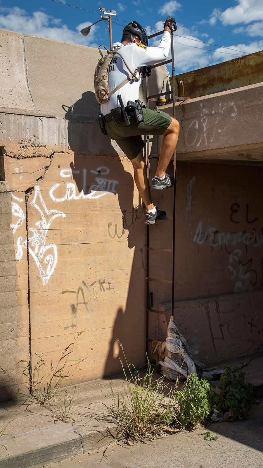 A Border Patrol agent enters the main drainage tunnel in Nogales, Arizona