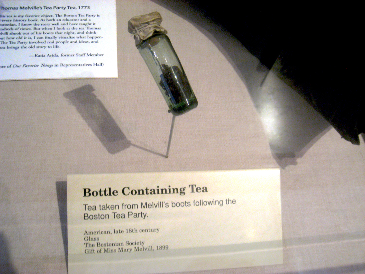Bottle containing the tea Thomas Melvill found in his boots after the Boston Tea Party in 1773. The Tea Party participants went to great lengths to ensure no one kept any of the precious tea. When Melvill returned to his home he discovered there were tea leaves in his boots, and so he placed the leaves in a vial and surreptitiously held them for the remainder of his life. Handed down in the Melvill family, the leaves were donated to Boston's Old State House Museum in 1899 by a descendent, Miss Mary Melvill.