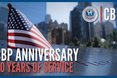 CBP Anniversary - 20 years of service. An American flag is shown atop the World Trade Center Memorial