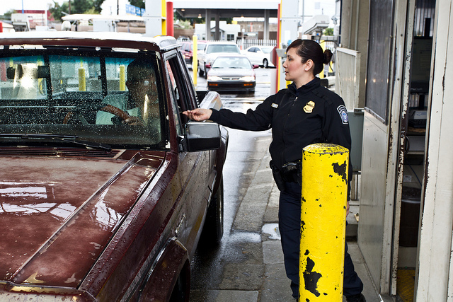 CBP officer processing travelers at a land port of entry. 