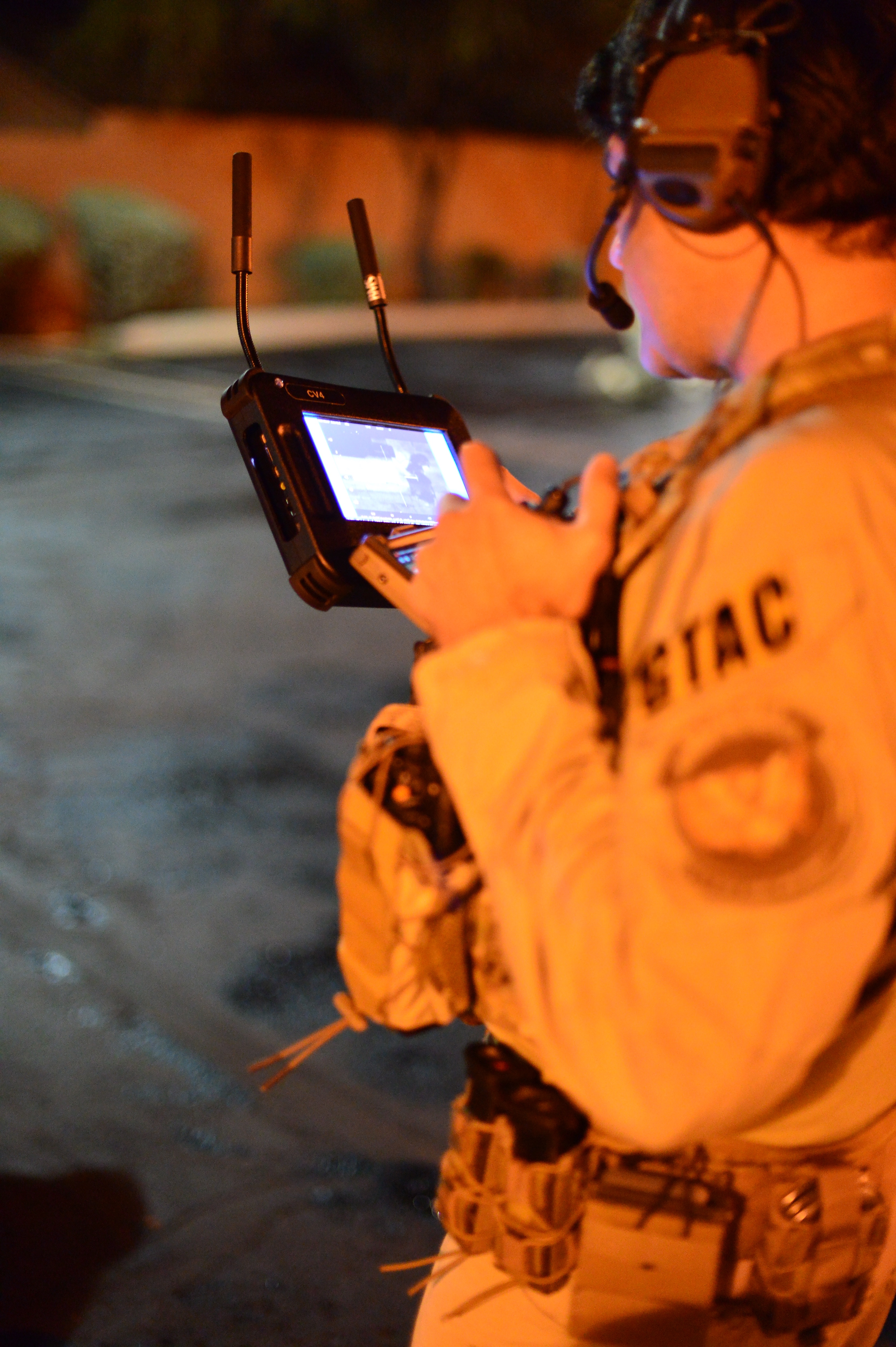 An AMO Ground Team Air Coordinator preparing for the execution of numerous search and arrest warrants in southern Arizona that dismantled a local drug trafficking organization suspected of distributing and selling heroin, marijuana, and various firearms.