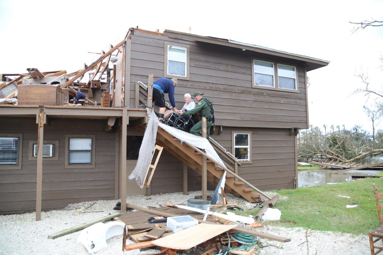 Rio Grande Valley Sector Border Patrol Special Operations Agents assist a disaster survivor trapped on the second floor of his home in Rockport, Texas August 26, 2017. Photo courtesy of U.S. Customs and Border Protection.