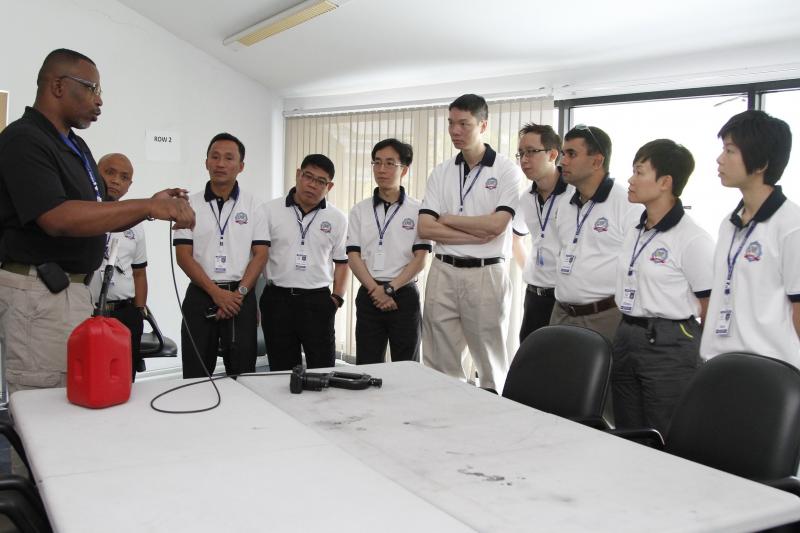 Instructor demonstrating how to use a fiber optic scope to Thailand Custom Officers