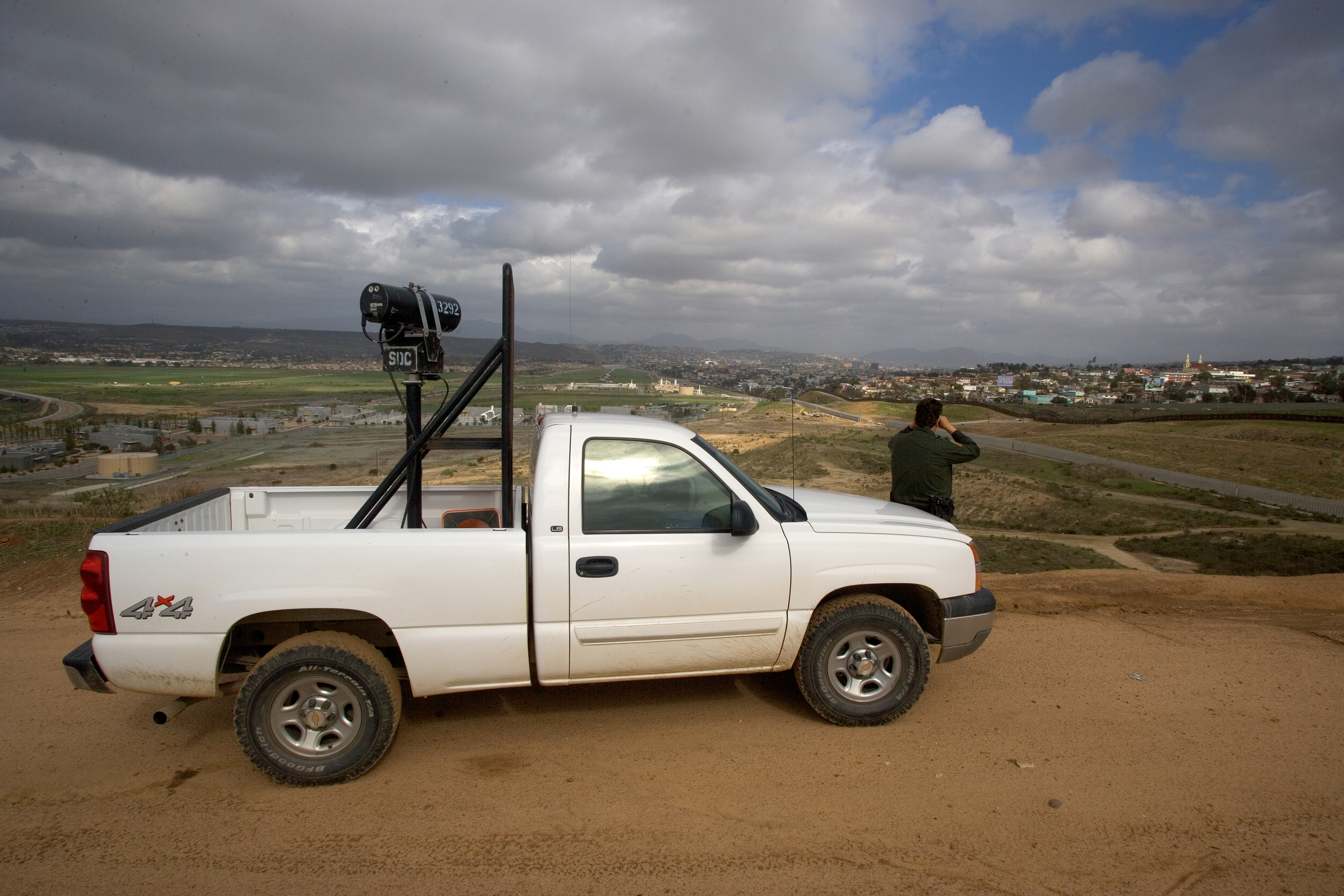 U.S. Border Patrol agent scans Imperial Valley area for signs of illegal crossings.