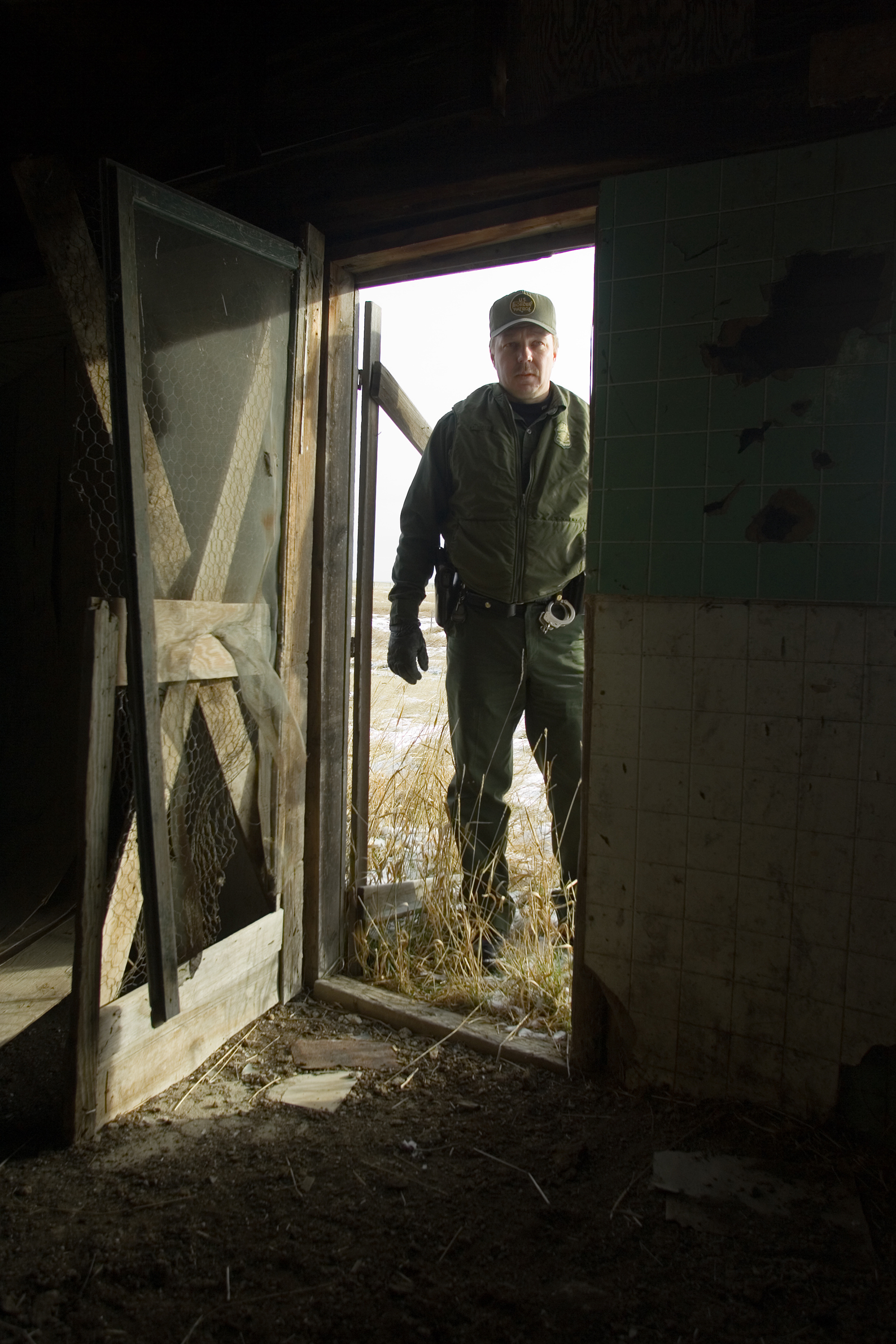Border Patrol agent stationed near Sweet Grass Montana conducts a search of an abandon house just over the US/Canadian border.