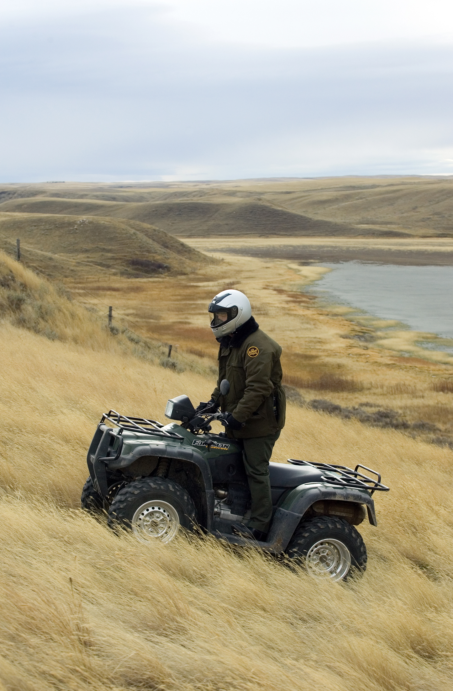Border Patrol agent uses All Terrain Vehicle to conduct routine patrols near the US/Canadian border near Sweet Grass Montana.