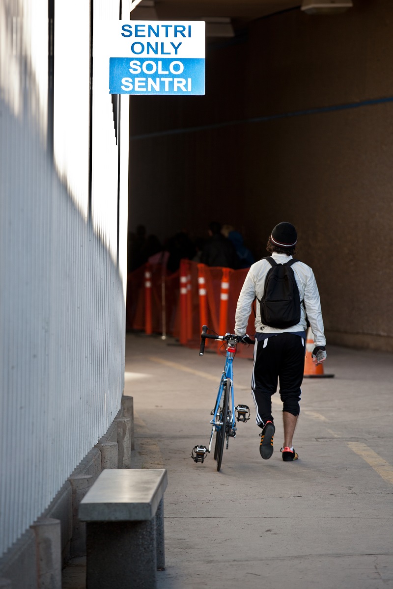 Bicyclist prepares to enter the dedicated SENTRI lane for frequent crossers at San Ysidro, Calif. port of entry. (photo by Josh Denmark)