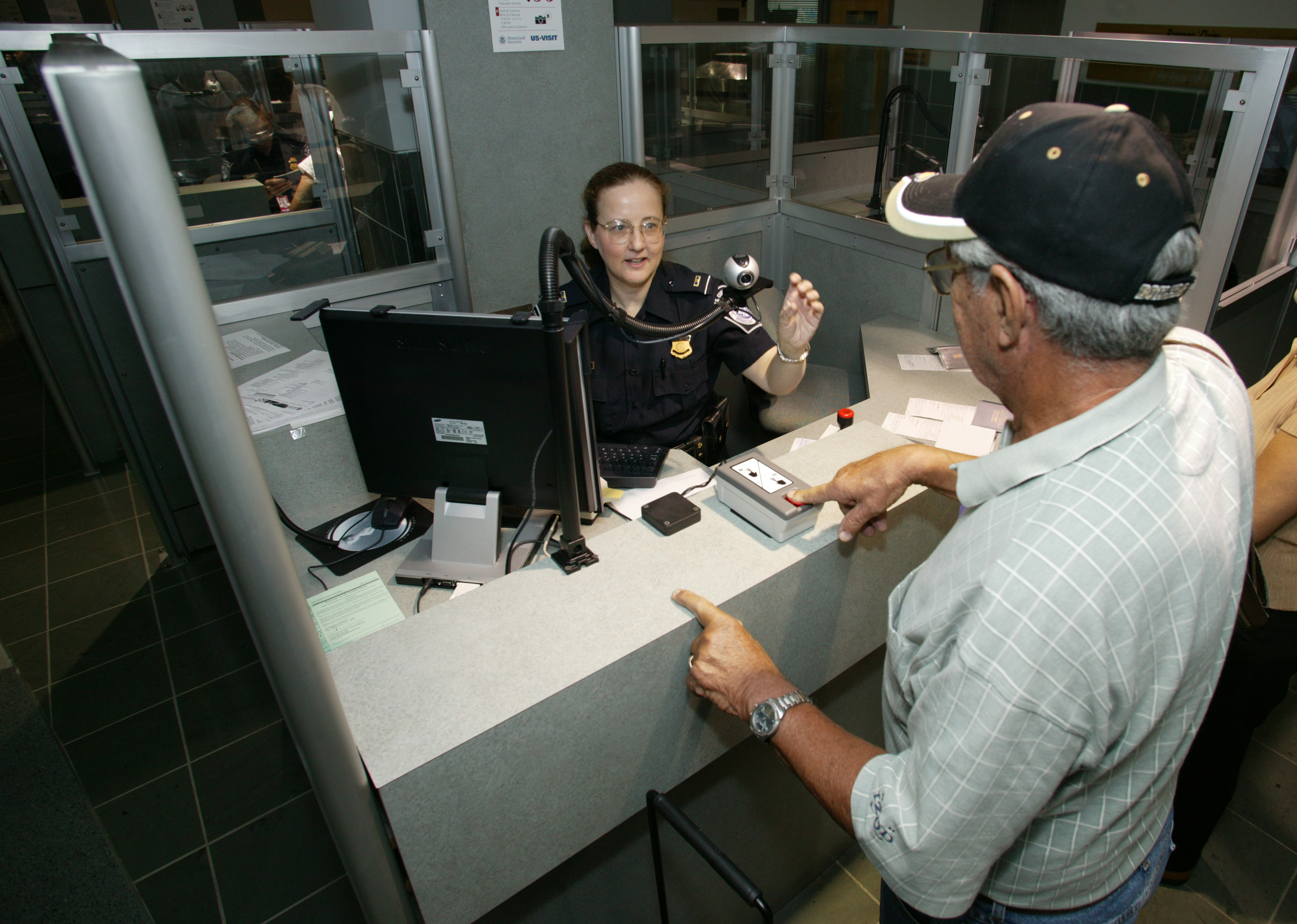 A CBP Officer uses new technologies to process passengers.