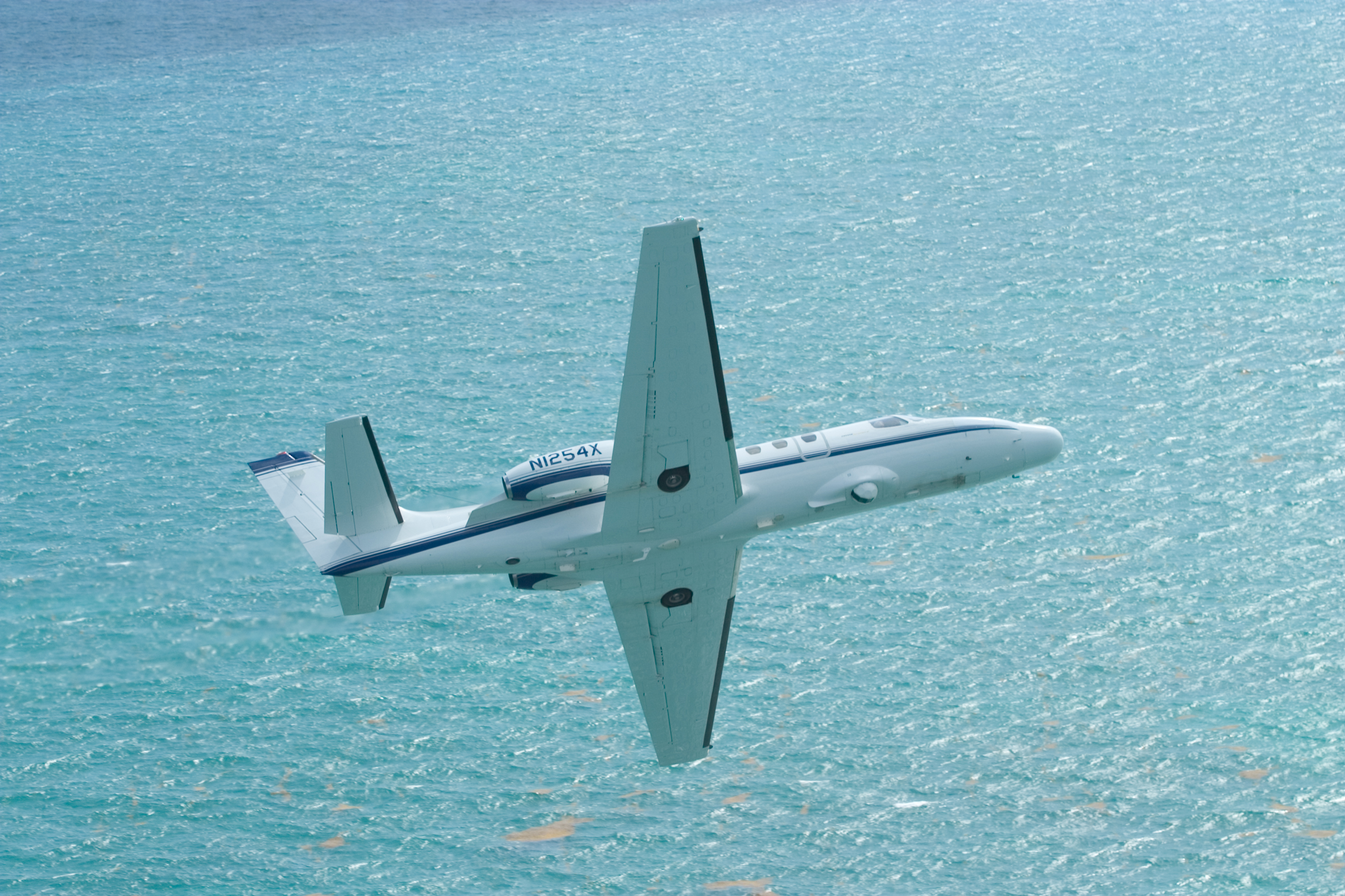 A CBP Cessna C-550 Citation patrolling the seas.