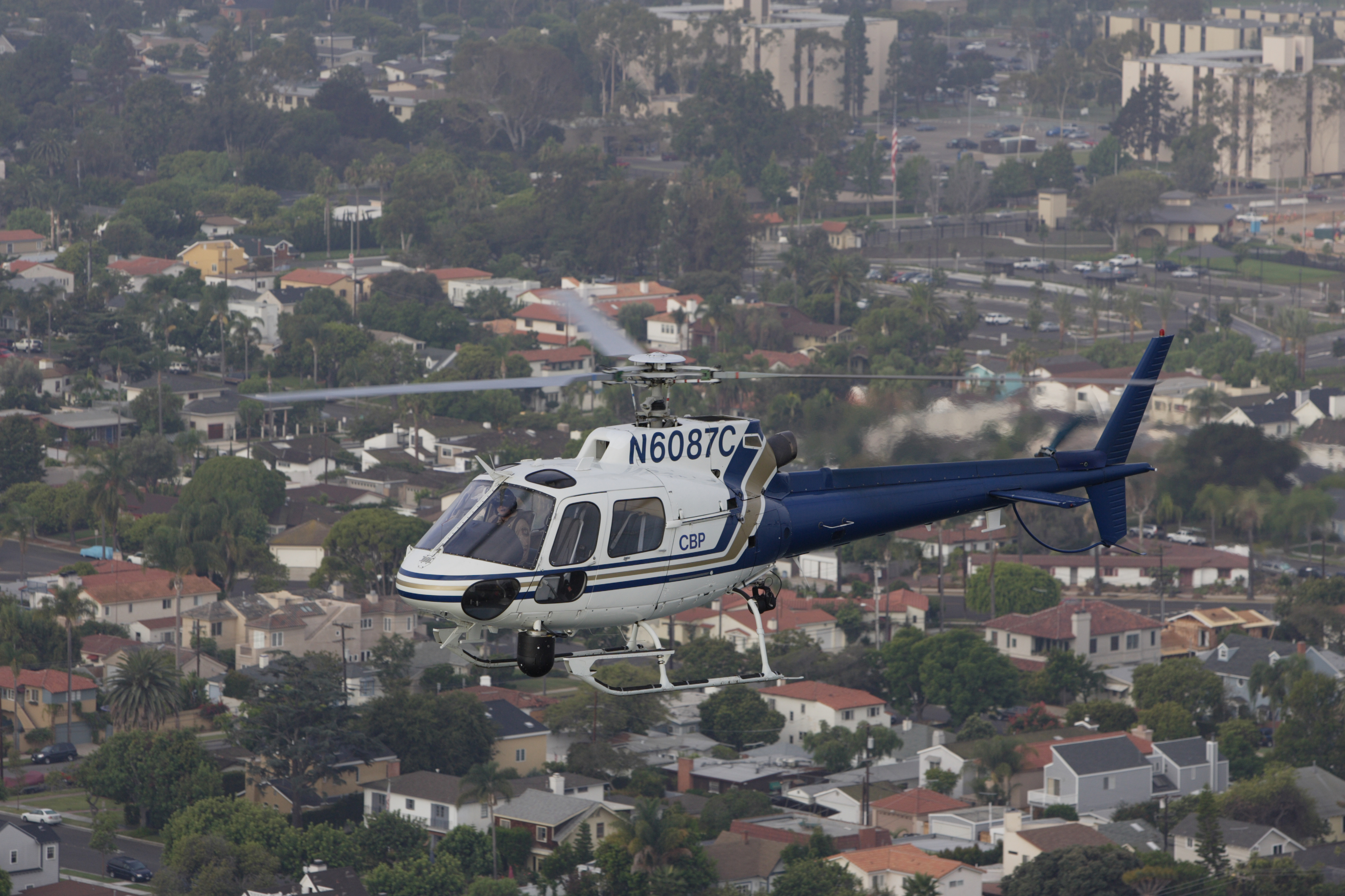 A CBP AS-350 A-Star helicopter conducts routine patrol in San Diego.