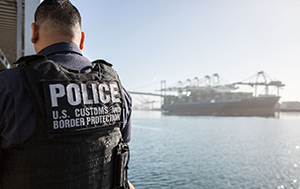 A CBP officer at the port of Los Angeles-Long Beach in California, awaits a cargo ship for inspection. Photo by Vincent Vuong