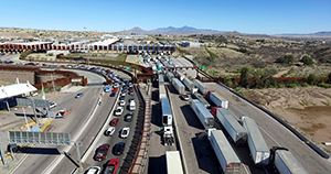 An aerial view of the Mariposa crossing at the port of Nogales in Arizona, shows a heavy stream of passenger vehicles and commercial cargo trucks arriving at the U.S. border.  Photo by Jerry Glaser, CBP file photo
