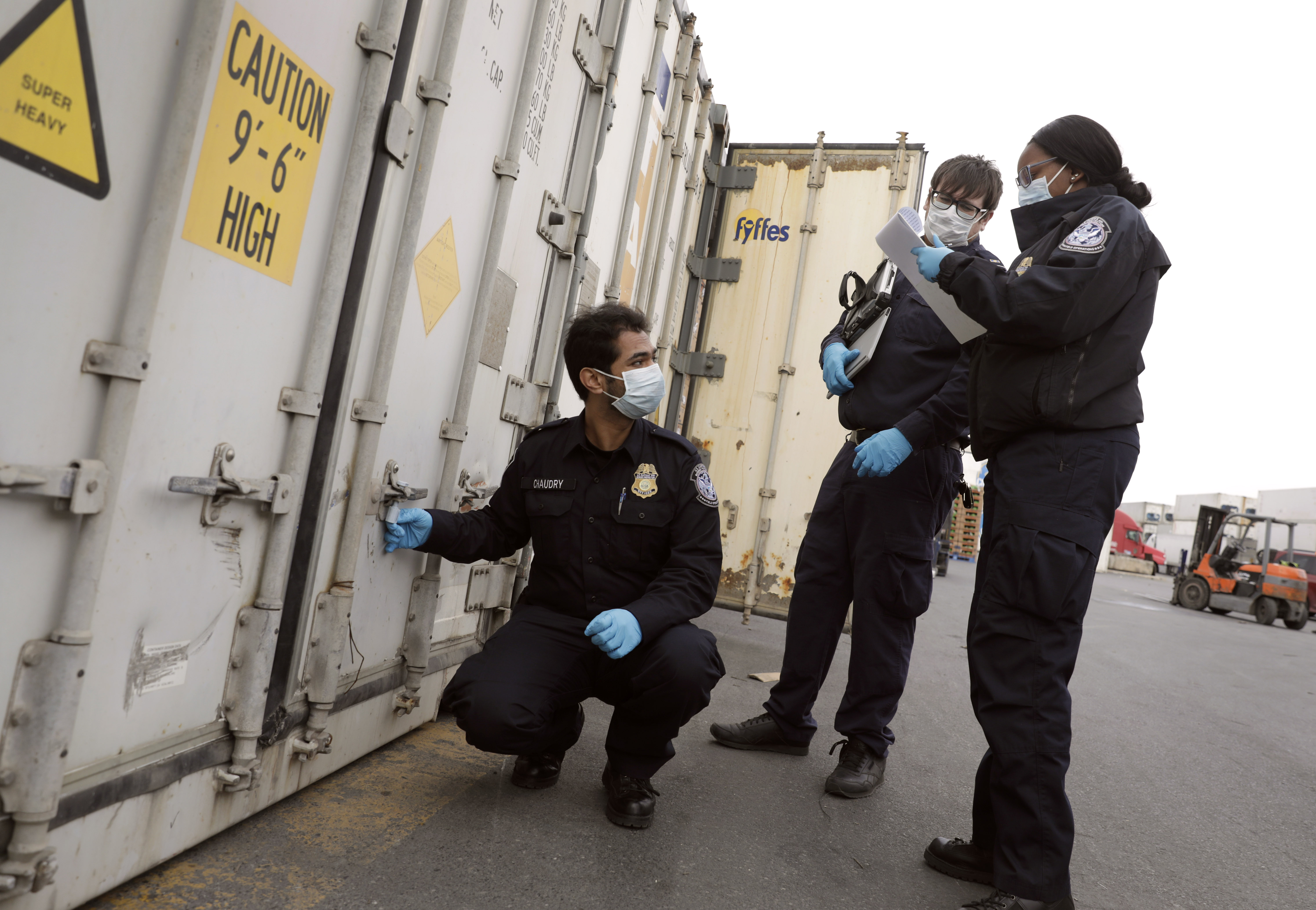 CBP agriculture specialists inspect a shipment
