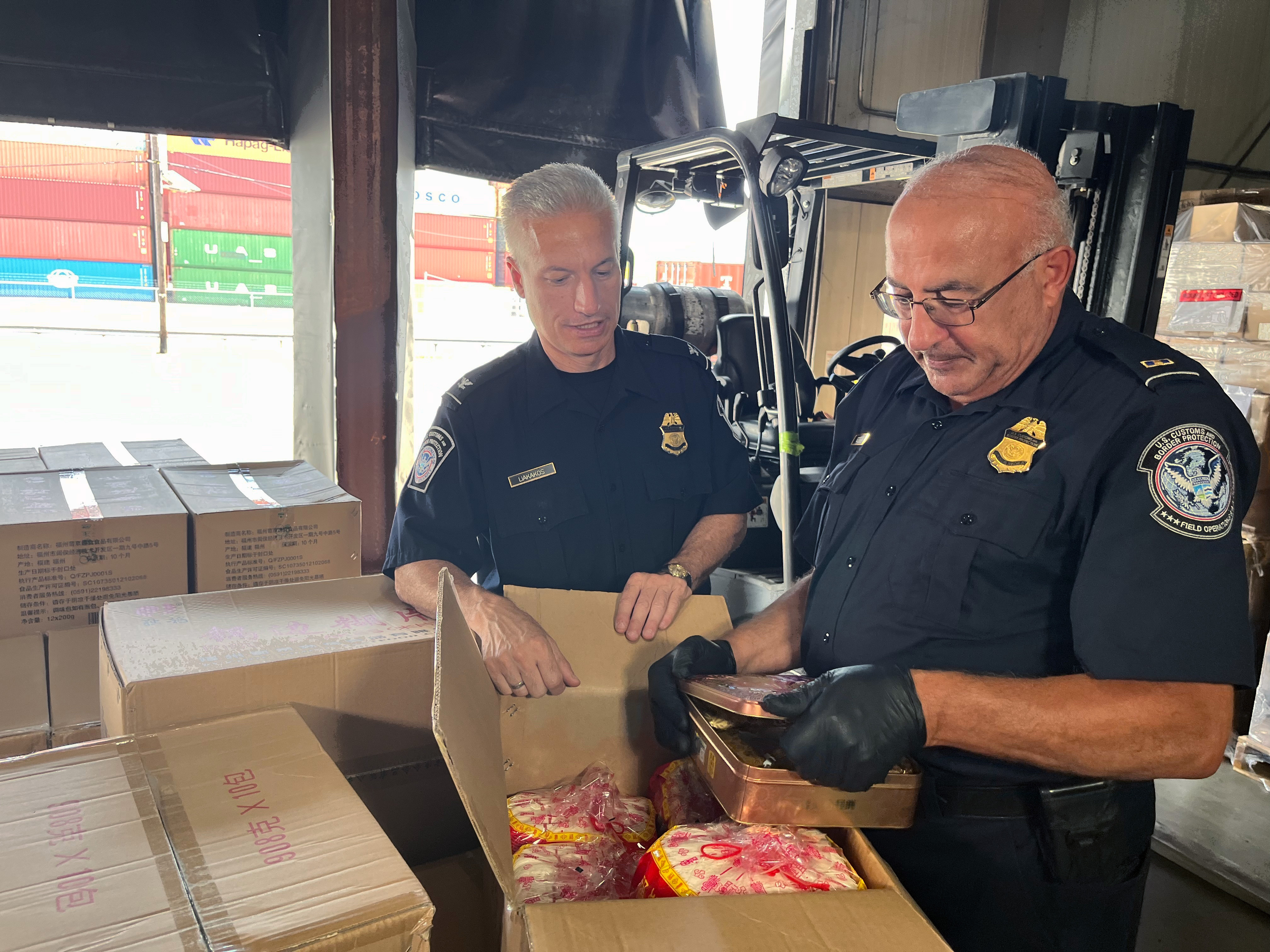 CBP agriculture specialists find smuggled pork moon cakes while conducting an exam at the seaport.