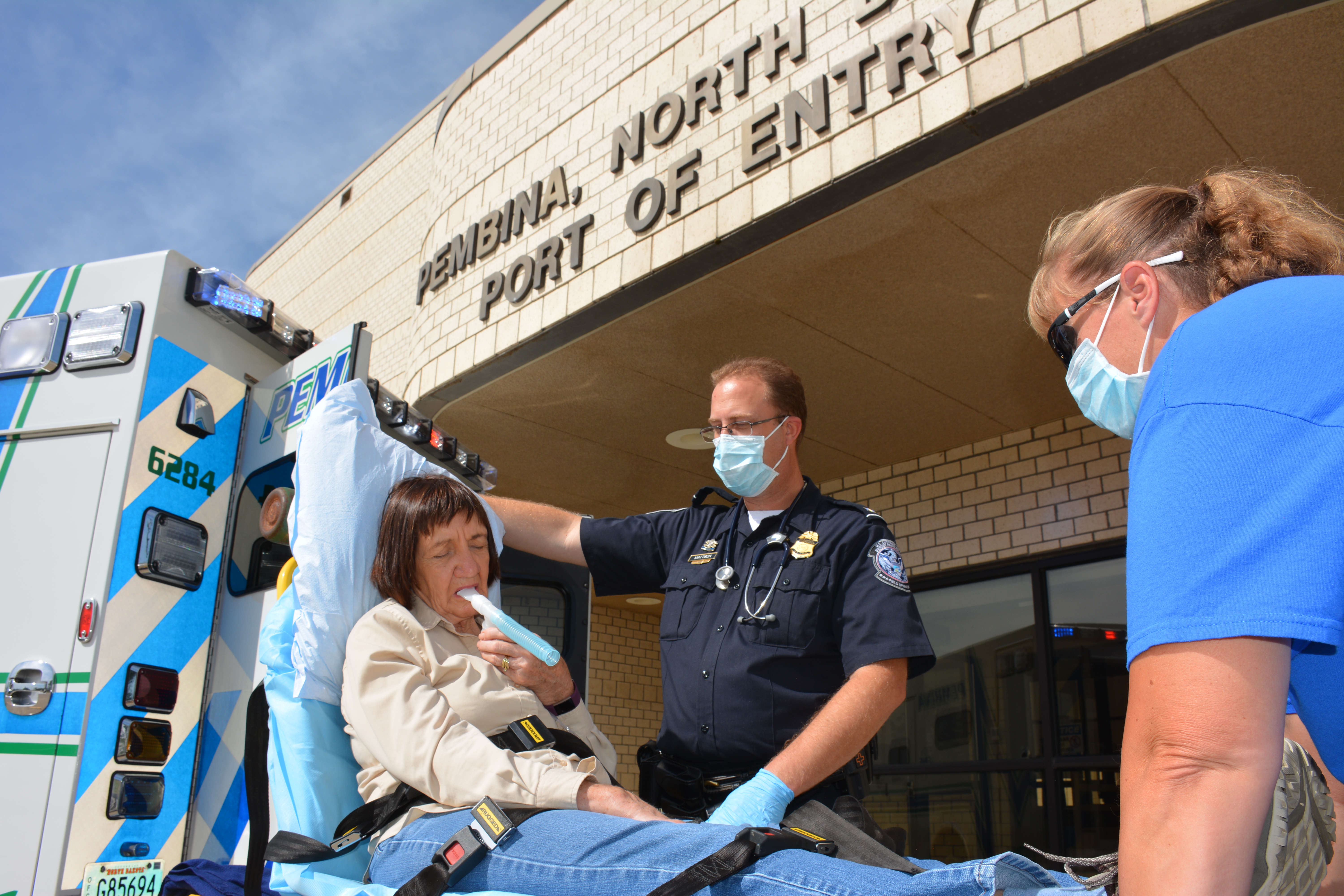 CBP Officer Jeremy Mattison helps a patient at port of Pembina, North Dakota.