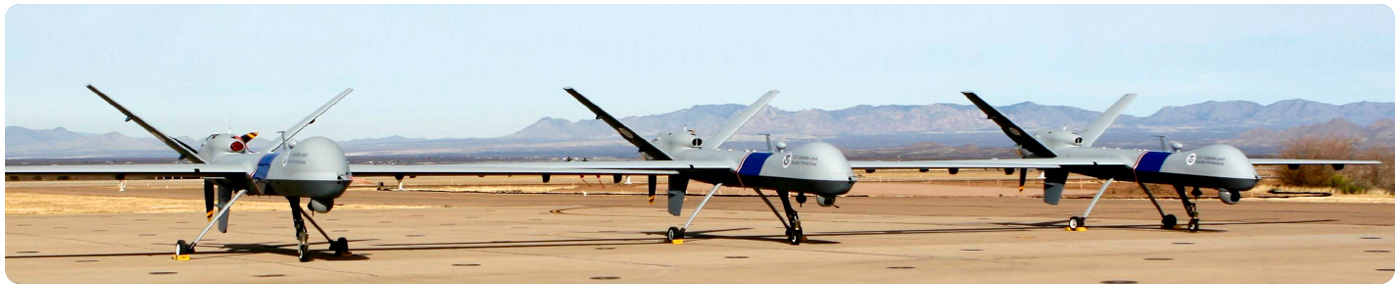 Three AMO Predator B unmanned aircraft stand ready to provide reconnaissance and surveillance support.