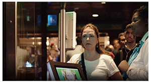 Woman using biometric facial comparison technoloy