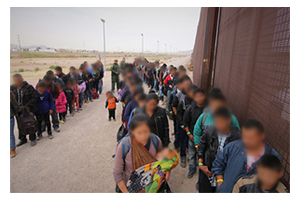Photograph of large group apprehended at the border