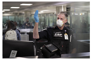 CBP officer processing travelers at an airport