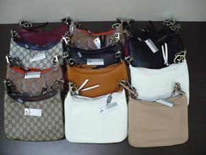 Purses lined up after CBP seized the items for being counterfeit
