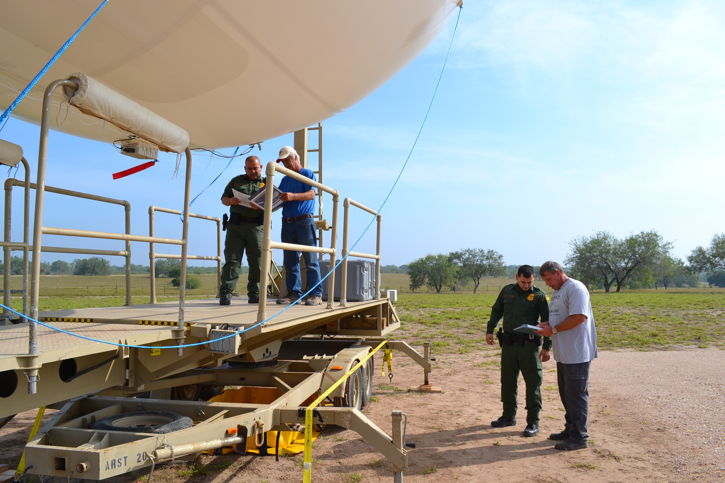 Photo of Border Patrol agents preparing tactical aerostat for launch in Rio Grande Valley, Texas.