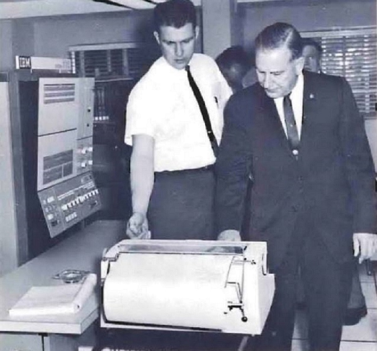 Photo of U.S. Customs Assistant Commissioner Norbert Strub witnessing a demonstration of the agency's new IBM computer system.