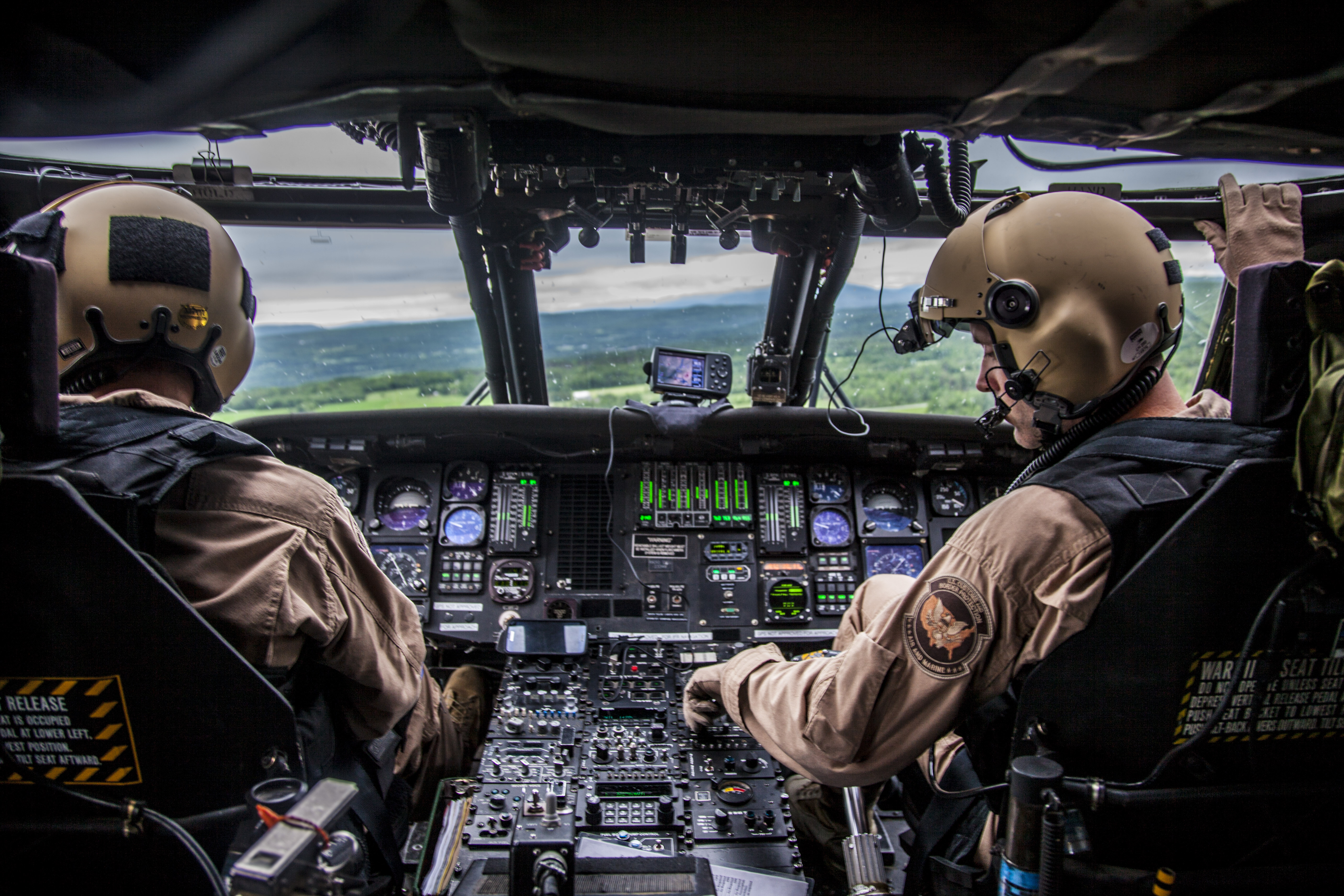 Photo of Air and Marine pilots in a helipcopter