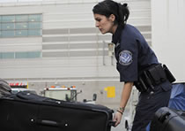CBP Officer Inspecting Luggage
