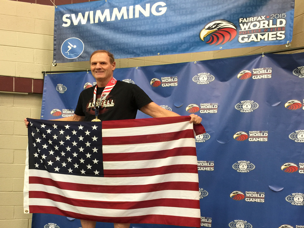 Photo of CBP swimmer from Denver on the award stand