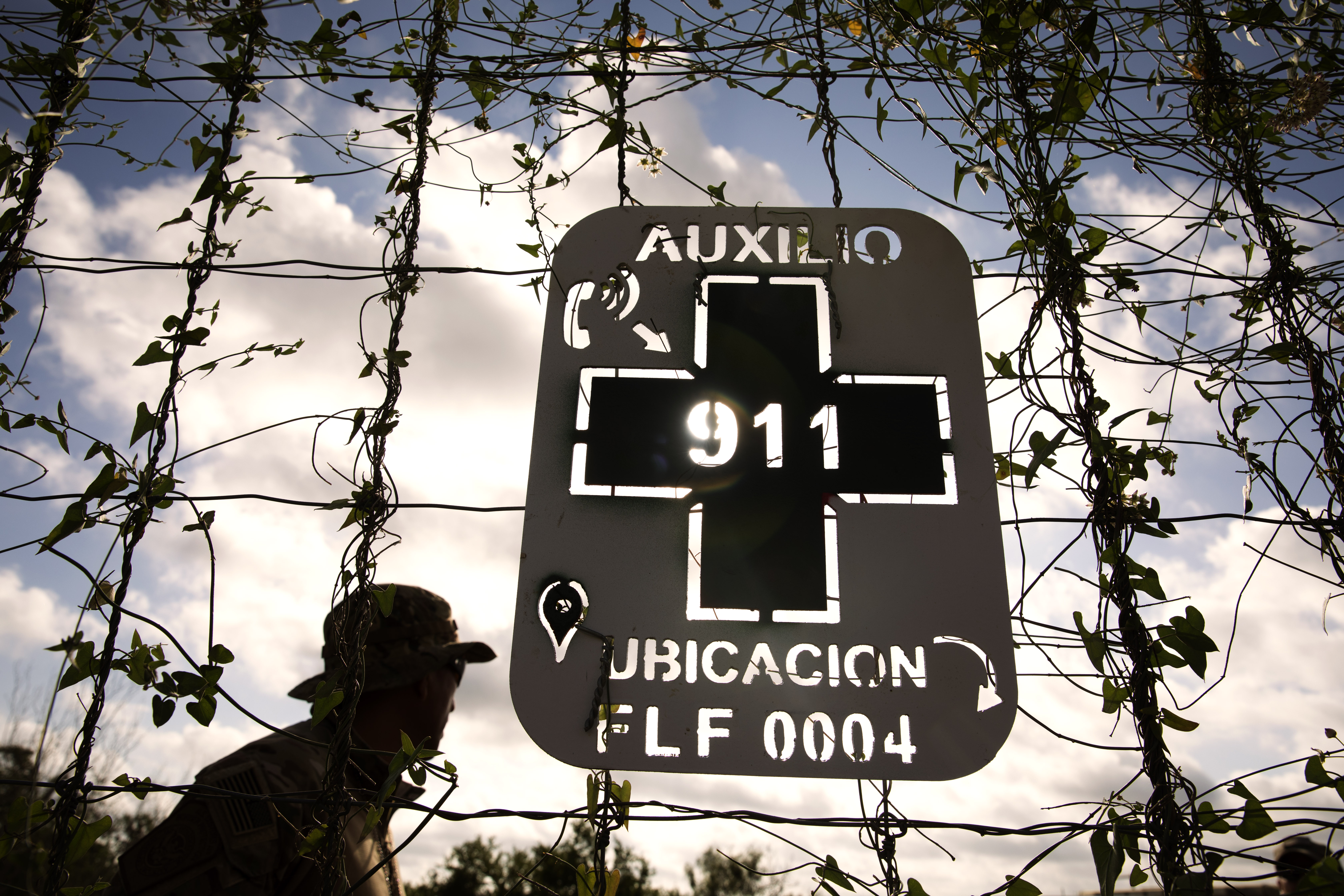 A sign posted by Border Patrol on a ranch in South Texas tells lost illegal aliens their exact location to speed their rescue by