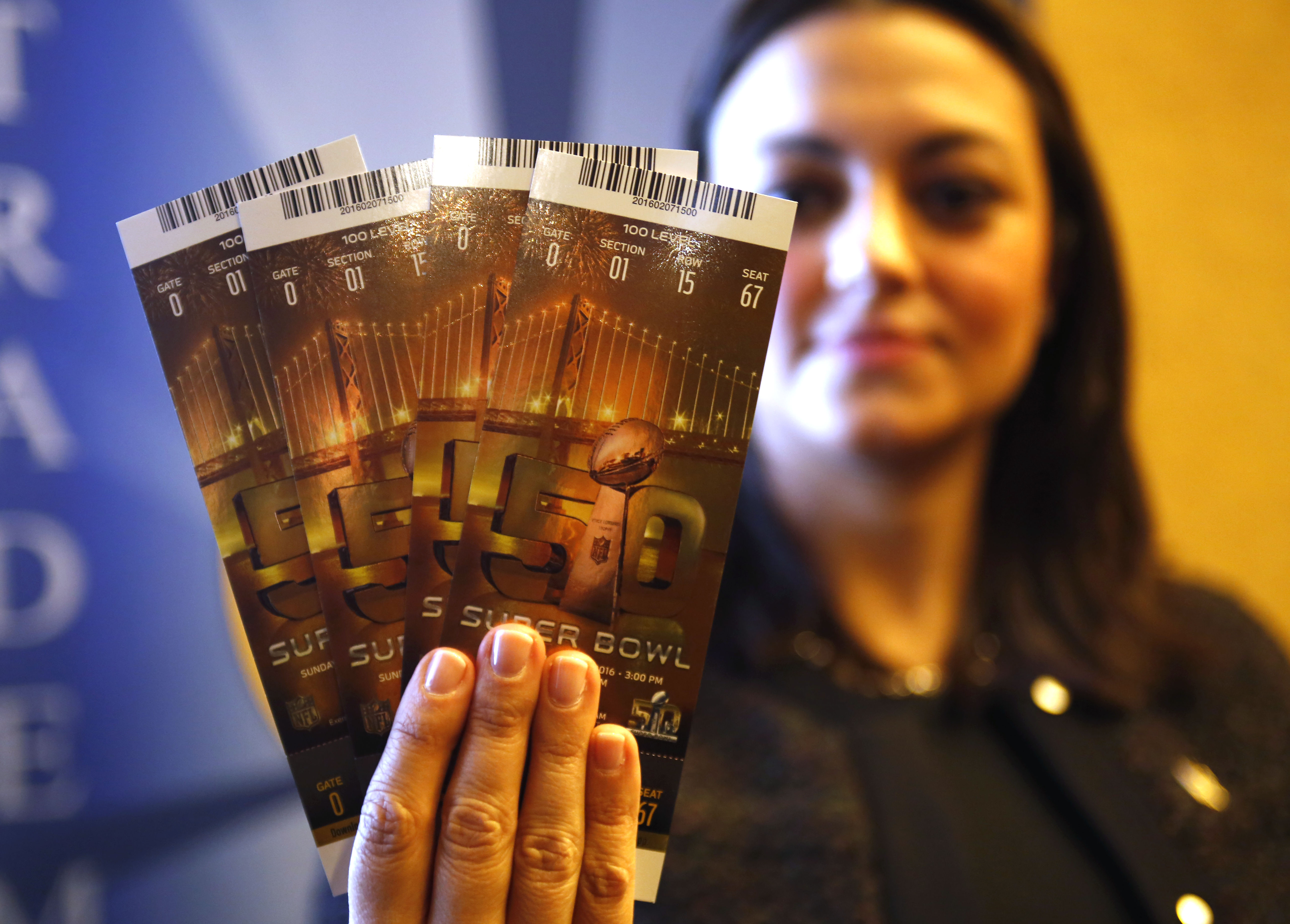 Photo of genuine Super Bowl tickets use heat sensitive ink and Super Bowl holograms to thwart counterfeiters. 