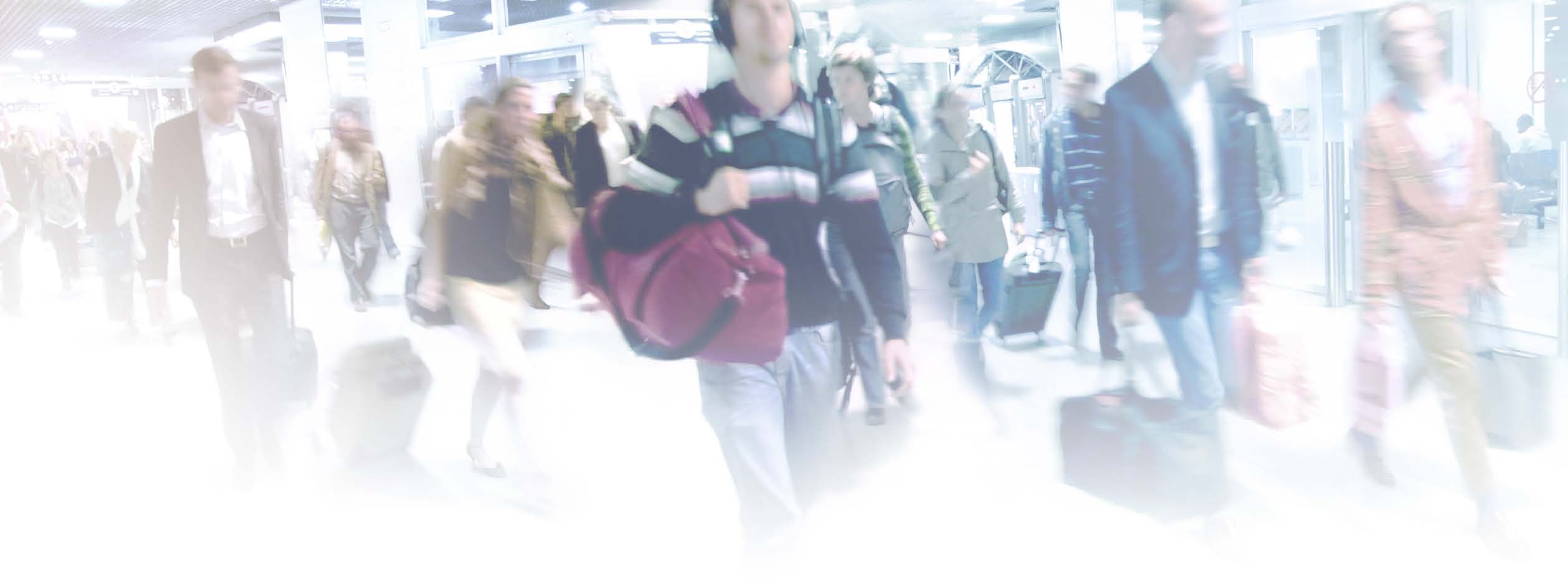 Passengers traveling through an airport.