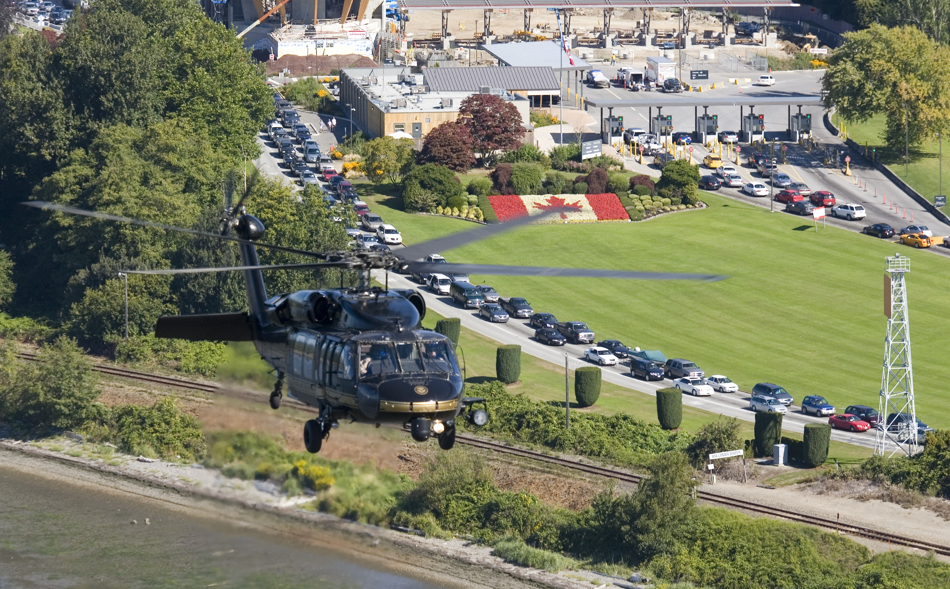 An Air and Marine Operations UH-60 crew from the Bellingham Air and Marine Branch flies near the U.S./Canada border.