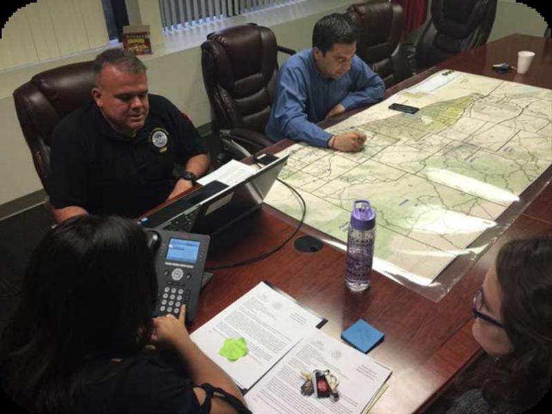USBP personnel help analyze a 911 call, using the caller’s description of their surroundings to narrow search location.