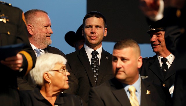 U.S. Customs and Border Protection Commissioner Kevin McAleenan takes his place on stage with leaders of law enforcement agencies from across the nation to memorialize fallen officers at the 30th Annual Candlelight Vigil on the National Mall in Washington, D.C.