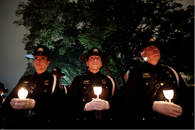 CBP officers reflect on fallen heroes at the 30th Annual Candlelight Vigil to memorialize fallen officers on the National Mall in Washington, D.C