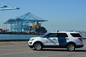 CBP officers arrive to conduct an initial inspection of a docked vessel at the port of Los Angeles-Long Beach in California, the busiest cargo seaport in the nation