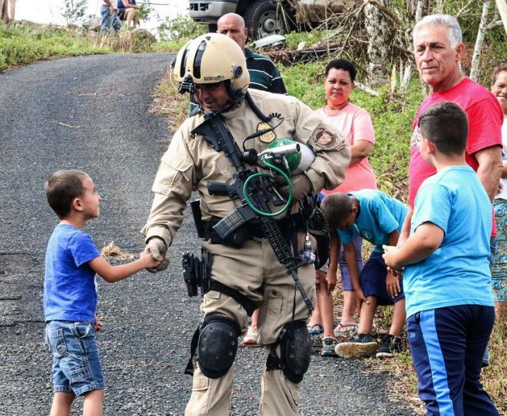 Agents with a U.S. Customs and Border Protection, Air and Marine Operations, Black Hawk crew distributes much-needed supplies to residents of Puerto Rico as they conduct post-Hurricane Maria humanitarian operations and assessments. 