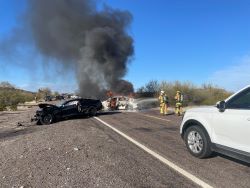 A U.S. Customs and Border Protection Officer and a Border Patrol Agent rescued three trapped motorists before one of the vehicles was engulfed in flames.