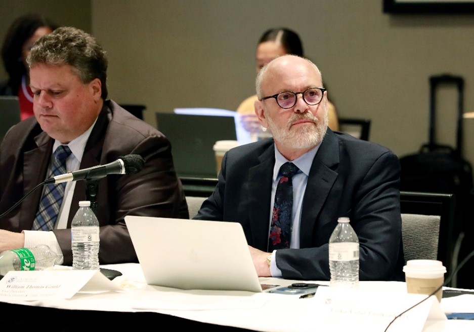 Two COAC members listen to a presentation at the September 14 meeting in Chicago. 
