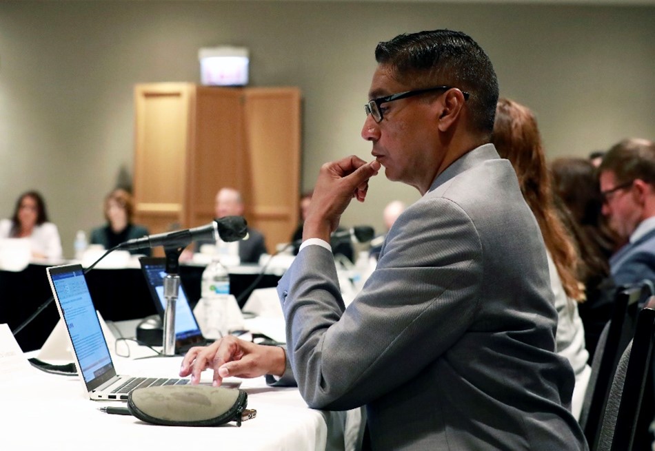 A COAC member pays close attention to the September 14 COAC meeting in Chicago. 