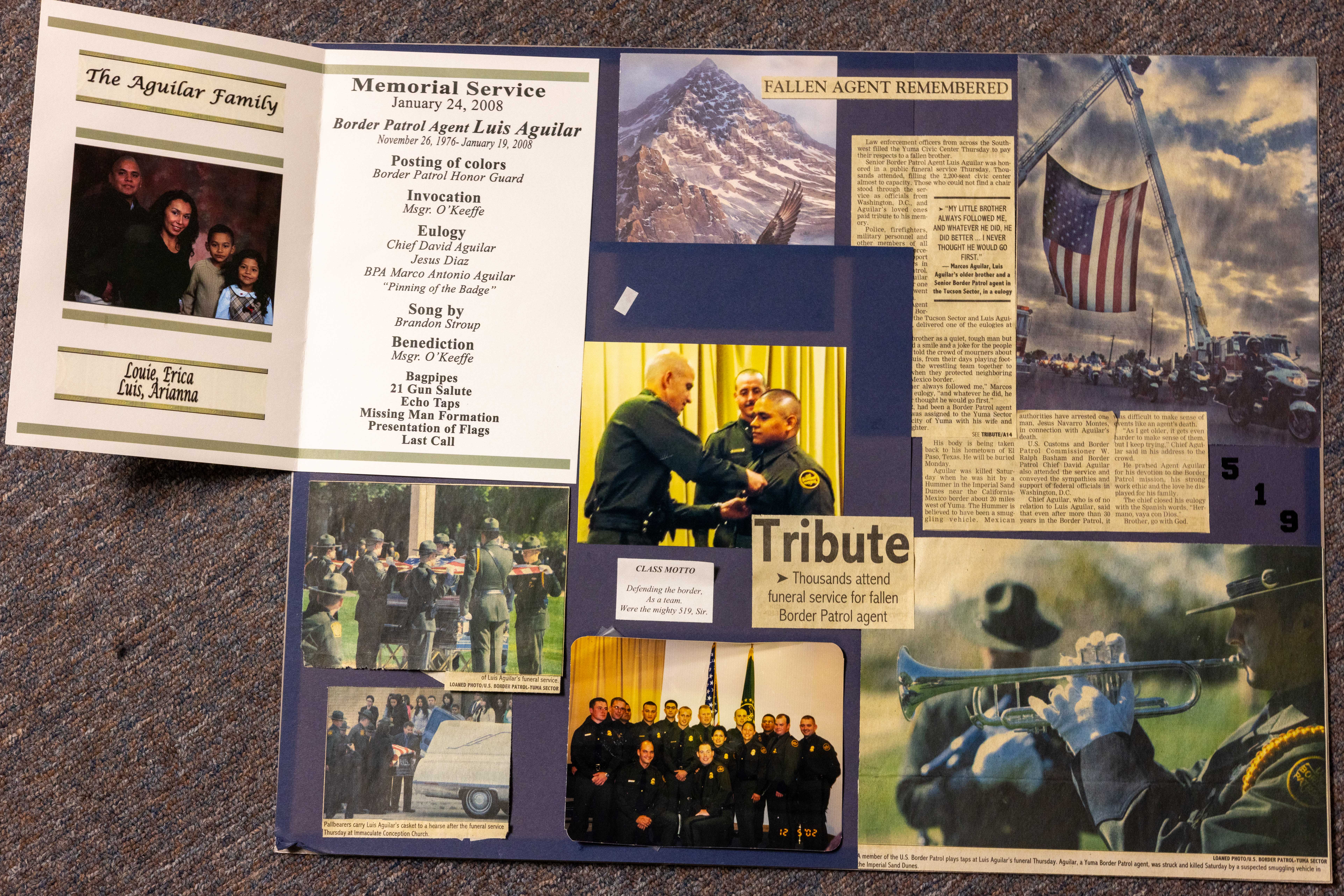 A board with images, a memorial service program and newspaper clippings highlight Border Patrol Agent Luis Aguilar.