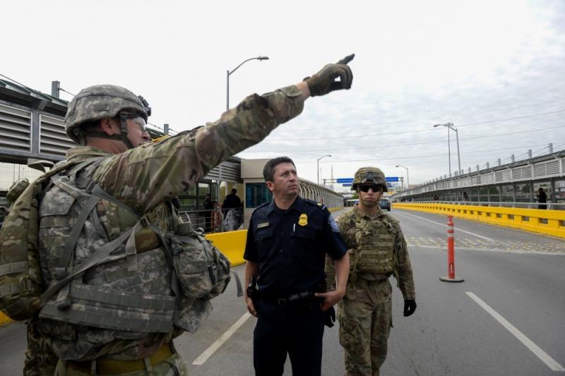 Soldiers from Ft. Riley, Kansas, work alongside with U.S. Customs and Border Protection officers and Border Patrol agents at the Hidalgo, Texas, port of entry, to strengthen areas along the border Nov. 2. U.S. Air Force photo by Senior Airman Alexandra Minor