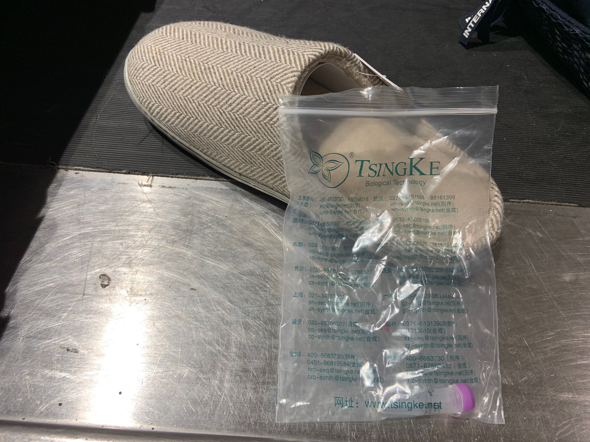 shoe and vial of mouse DNA