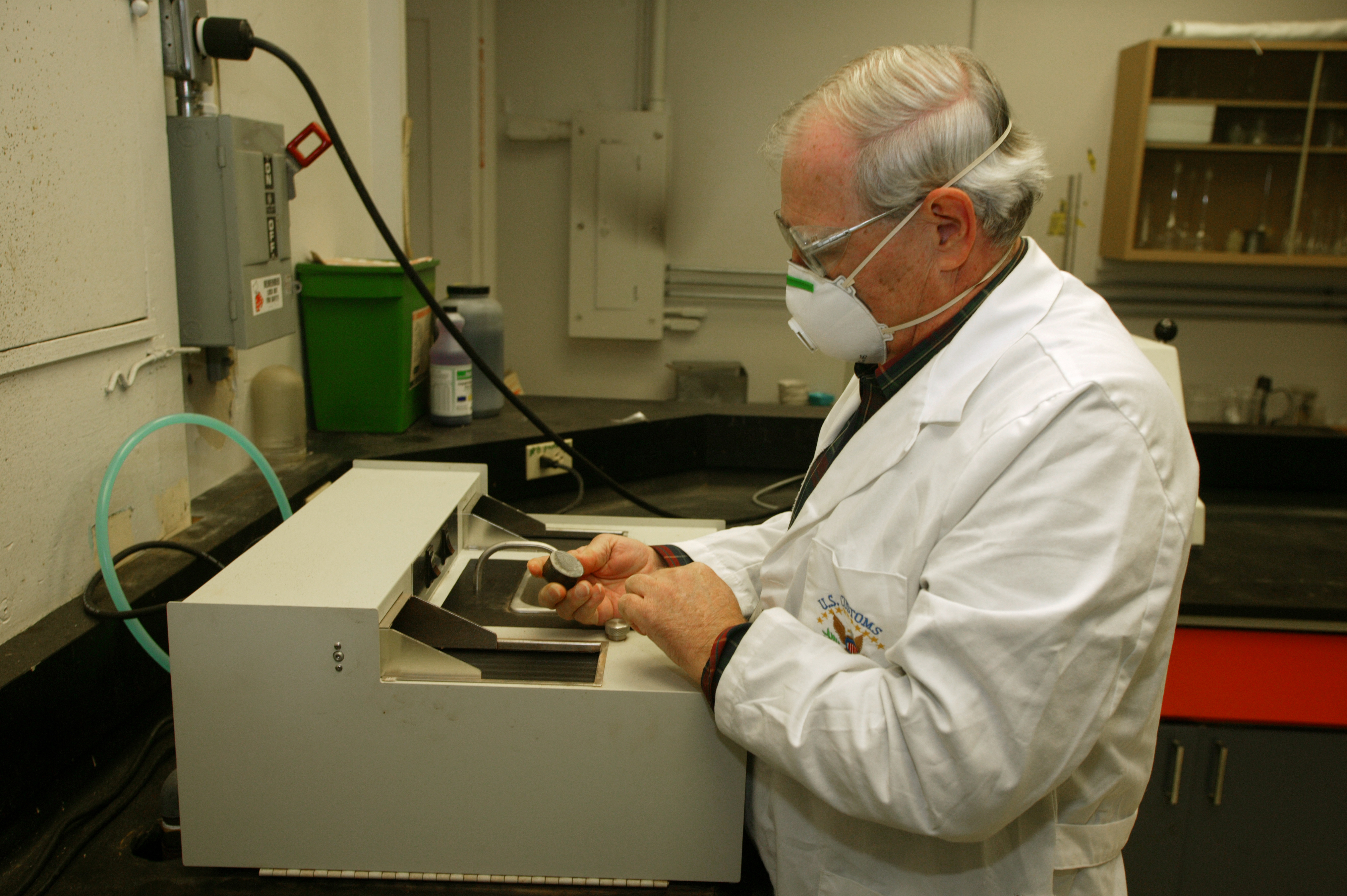 CBP Laboratory personnel grind samples of marble  material imported to the U.S. for testing.